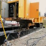 B&acirc;che de stockage avec bandes de roulage pour engins roulants contenant des huiles di&eacute;lectriques