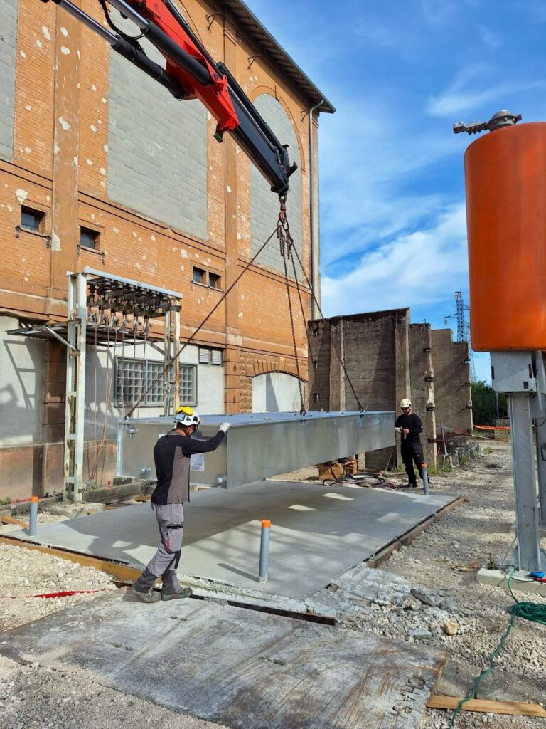 Installation of the first modular tank by SONEC staff on a clean concrete platform